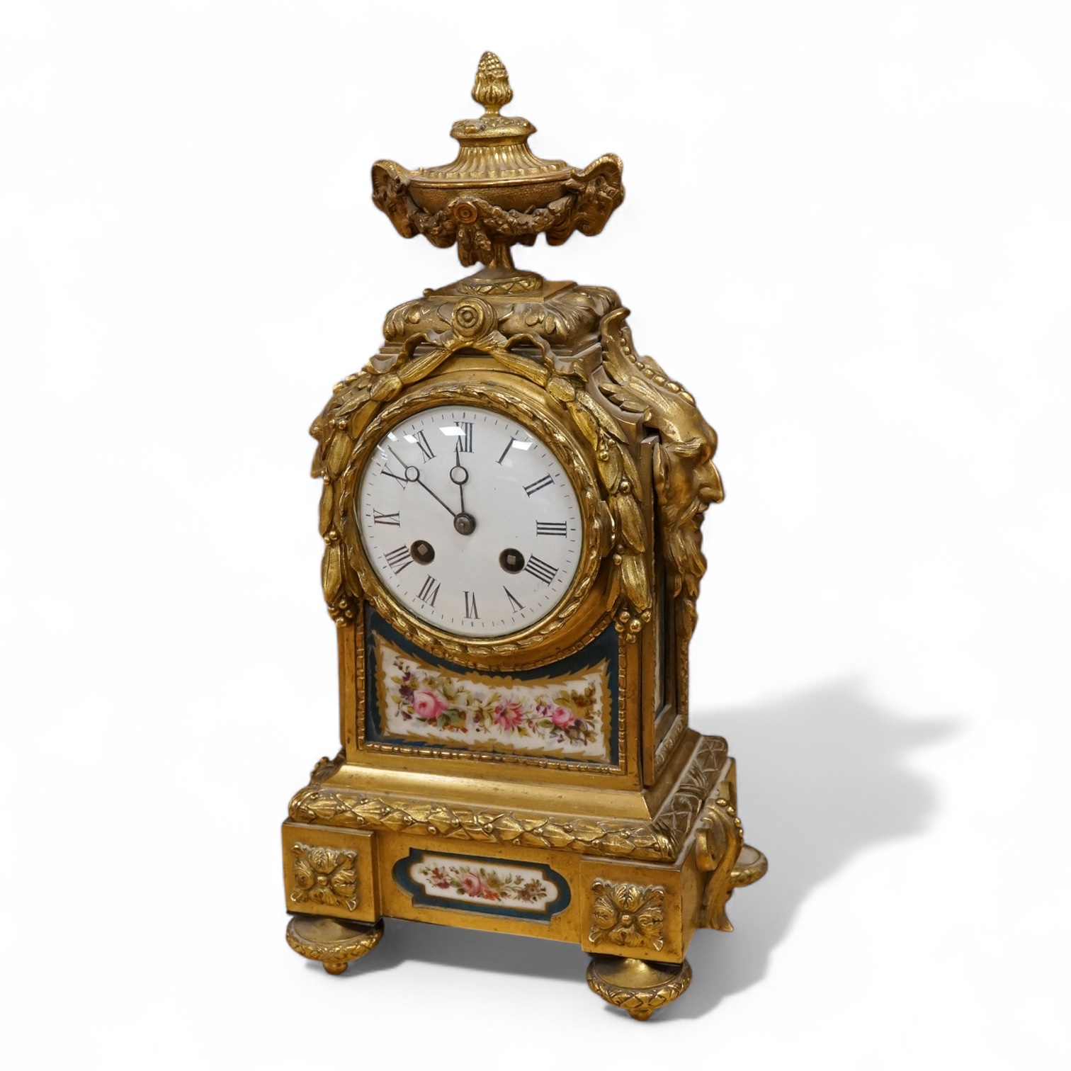 A 19th century French ormolu mantel clock with email dial and hand painted panels, with pendulum, no key, 39cm high